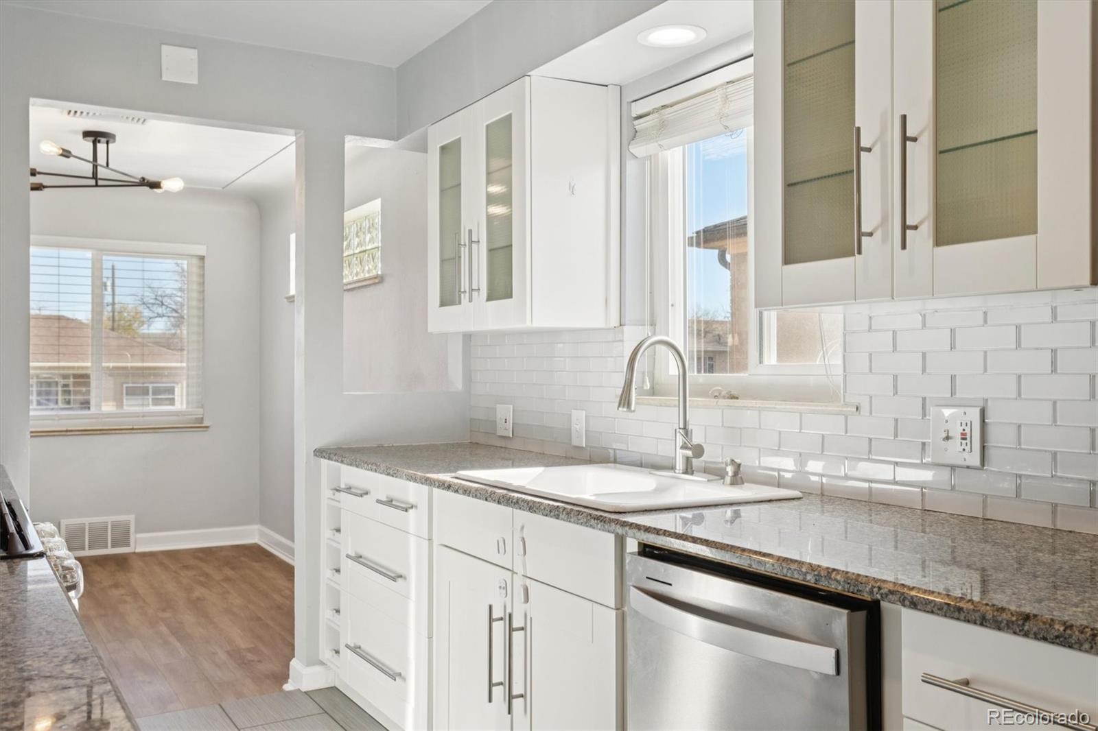 81 South Ingalls Street Lakewood, CO 80226 - Photo 14 of 29 a bathroom with a sink and a mirror