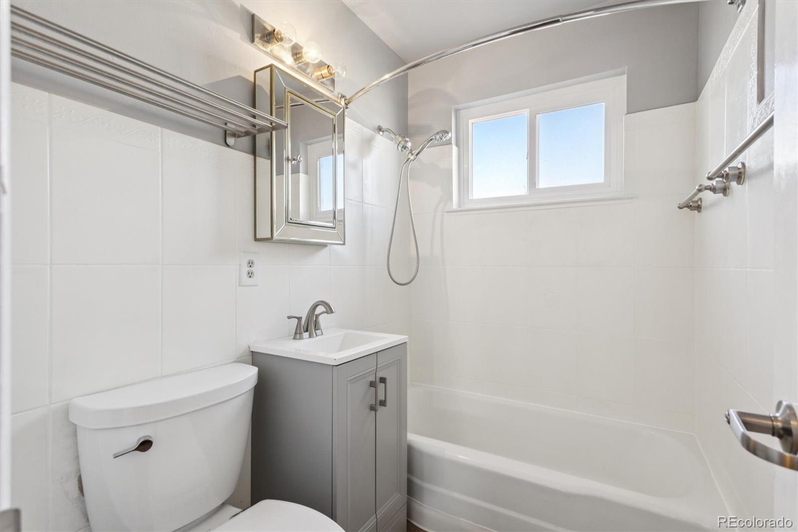 81 South Ingalls Street Lakewood, CO 80226 - Photo 16 of 29 a bathroom with a sink toilet and shower