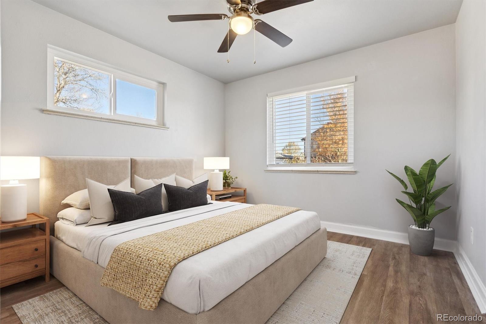 81 South Ingalls Street Lakewood, CO 80226 - Photo 2 of 29 a bedroom with bed and a large window