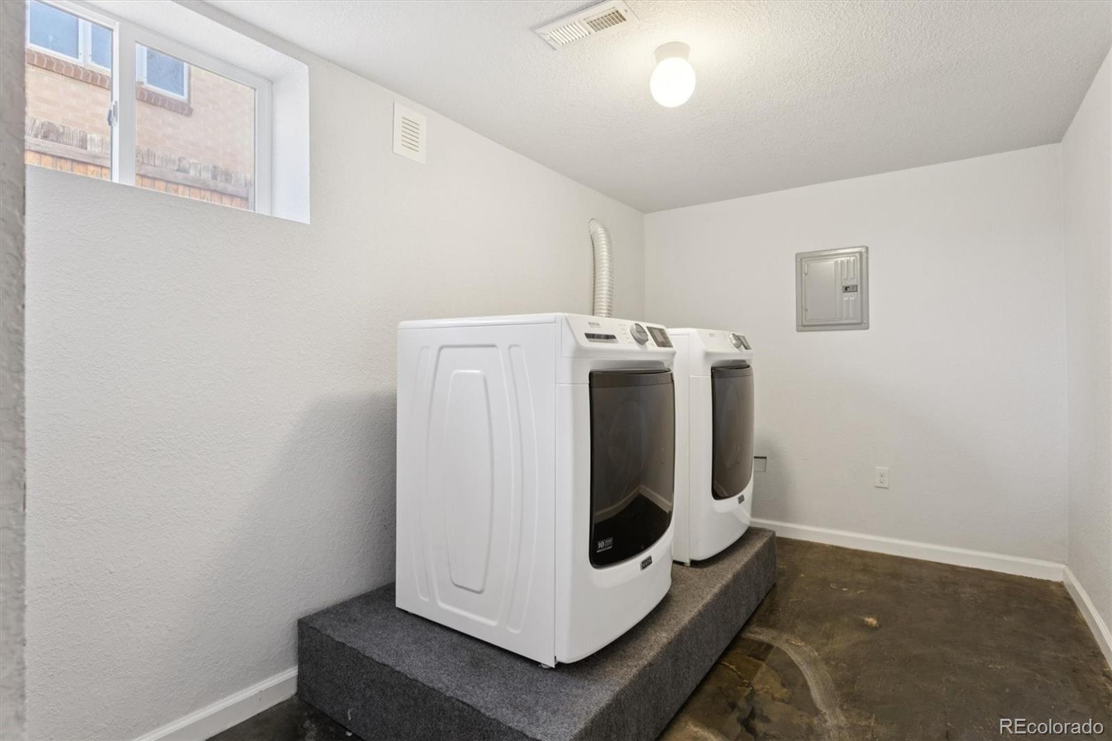 81 South Ingalls Street Lakewood, CO 80226 - Photo 23 of 29 a utility room with dryer and washer