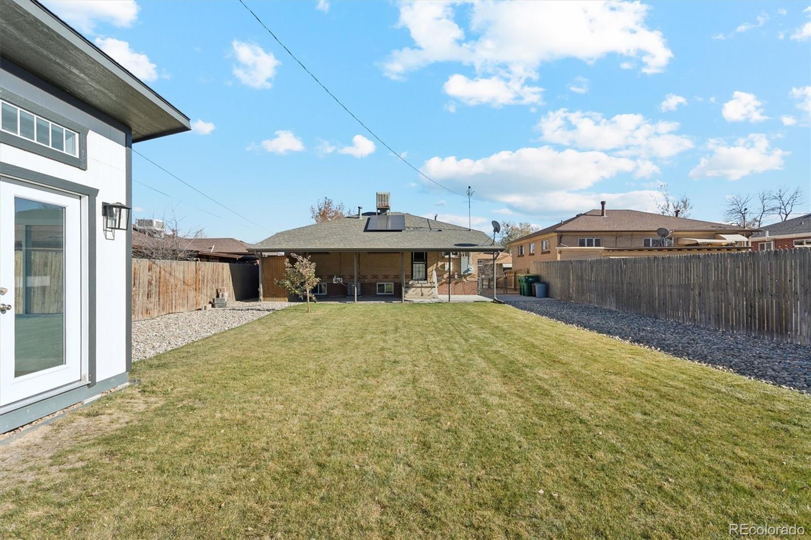 81 South Ingalls Street Lakewood, CO 80226 - Photo 25 of 29 a view of a house with a backyard