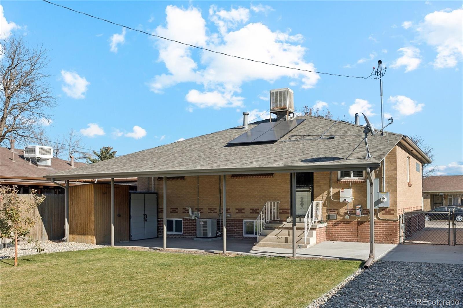 81 South Ingalls Street Lakewood, CO 80226 - Photo 28 of 29 a view of a house with floor to ceiling windows and a basket ball poll