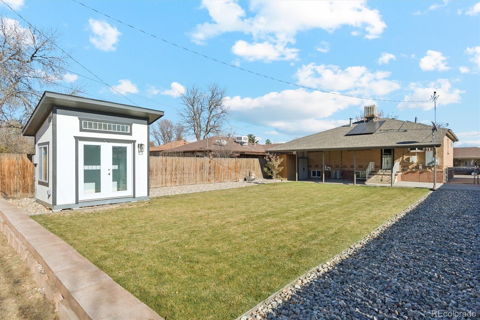81 South Ingalls Street Lakewood, CO 80226 - Photo 29 of 29 a front view of a house with a garden and yard