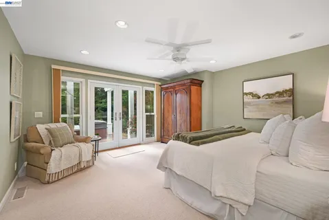 a bathroom with a granite countertop sink mirror and shower