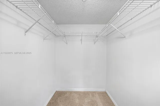 a view of a lake with a house in the background