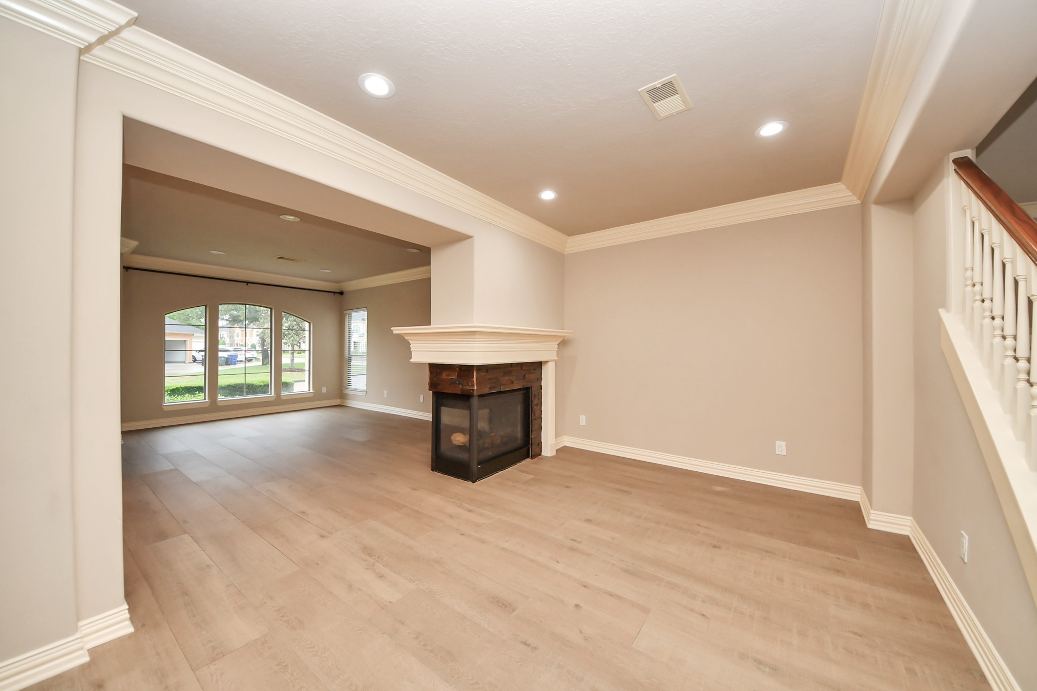 14454 Summerleaf Lane Houston, TX 77077 - Photo 11 of 50 a view of an empty room with a fireplace and a window
