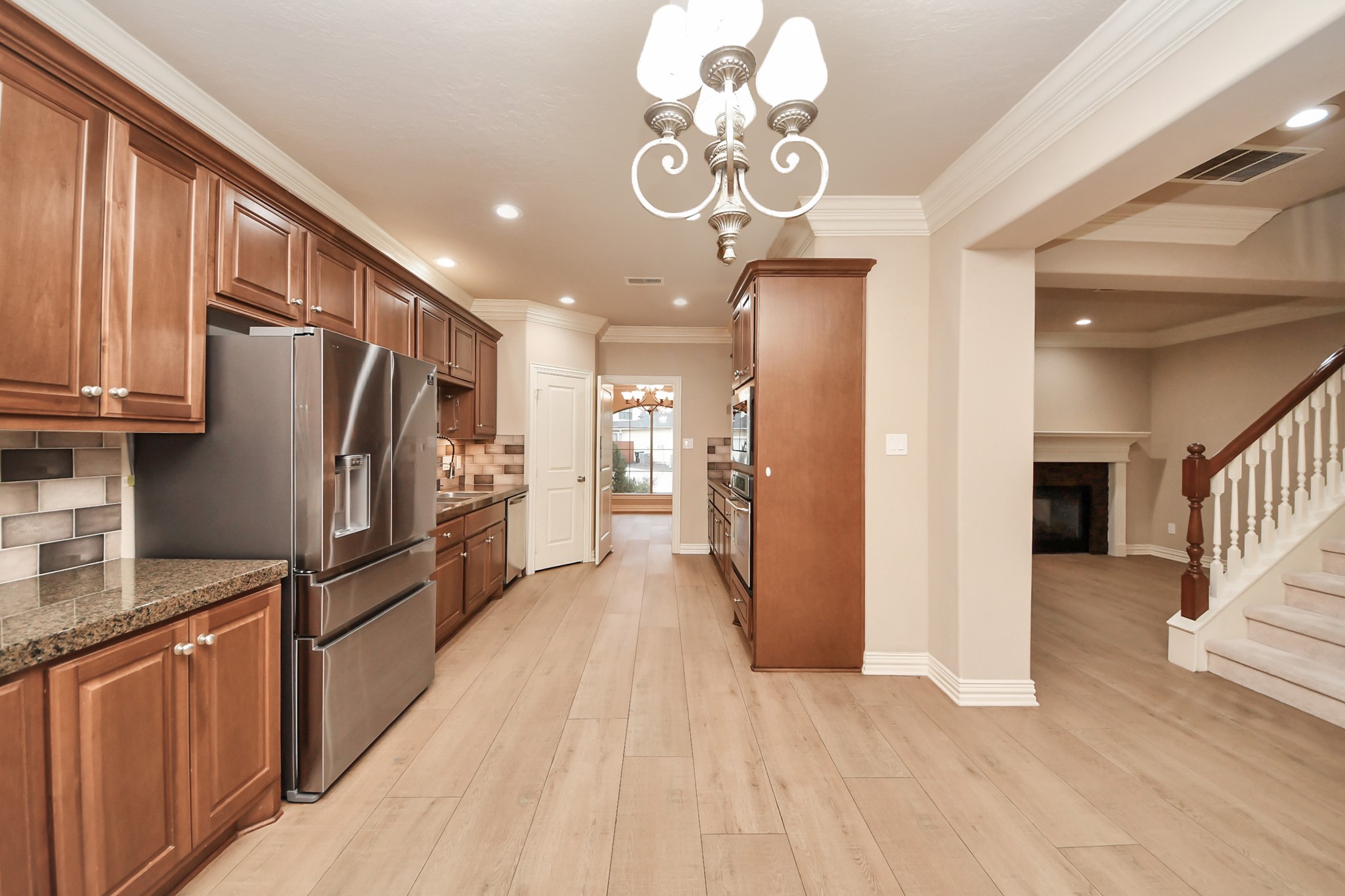 14454 Summerleaf Lane Houston, TX 77077 - Photo 18 of 50 a kitchen with stainless steel appliances granite countertop a refrigerator oven a sink dishwasher and wooden cabinets