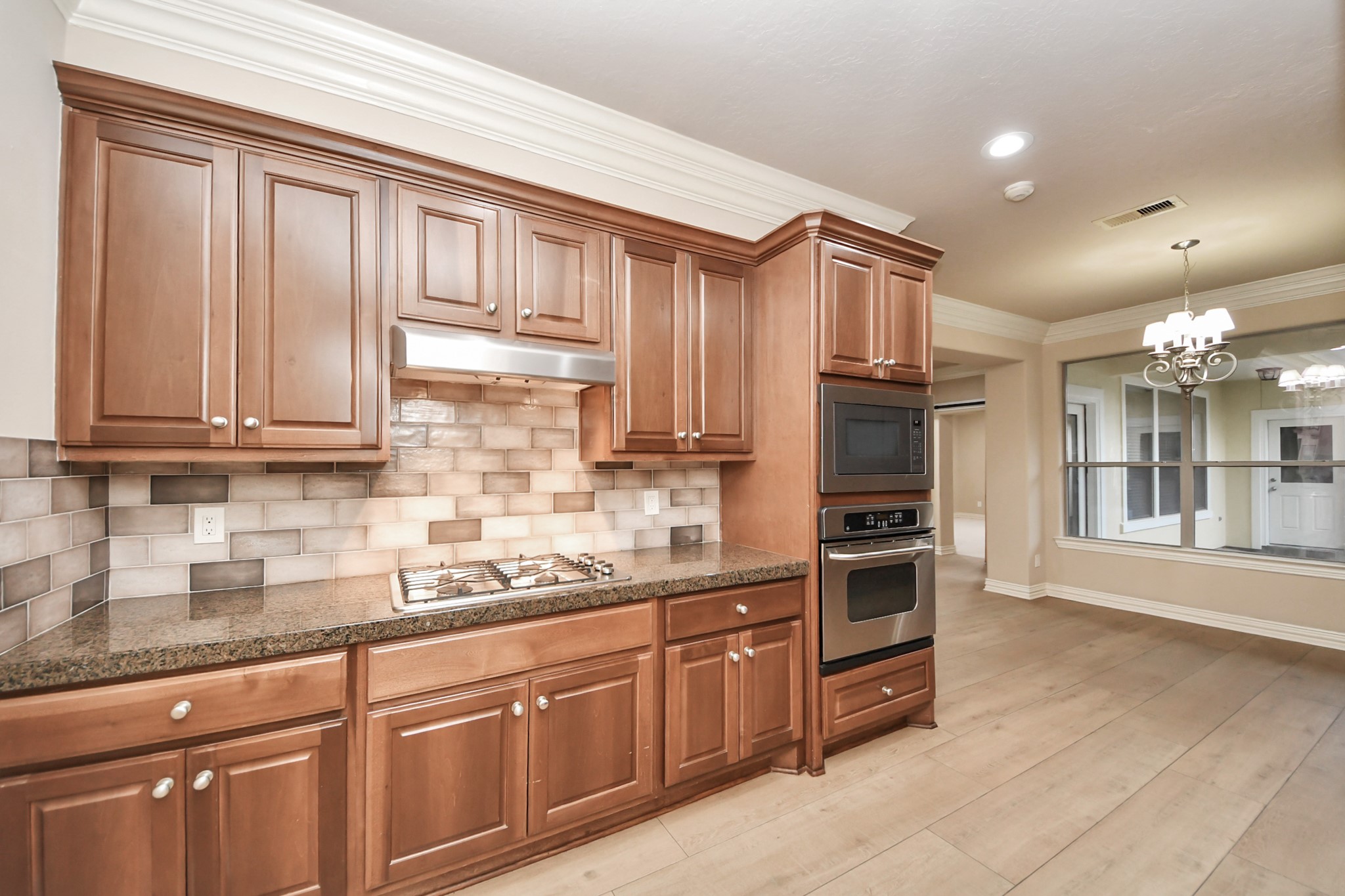 14454 Summerleaf Lane Houston, TX 77077 - Photo 23 of 50 a kitchen with stainless steel appliances granite countertop a refrigerator and cabinets