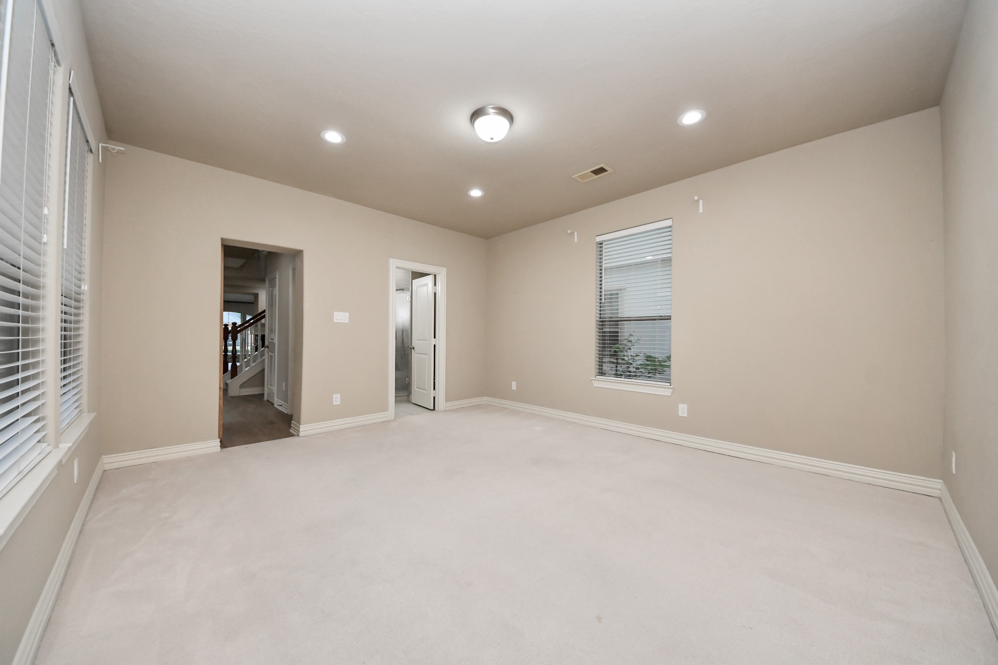 14454 Summerleaf Lane Houston, TX 77077 - Photo 30 of 50 a view of an empty room with window and wooden floor