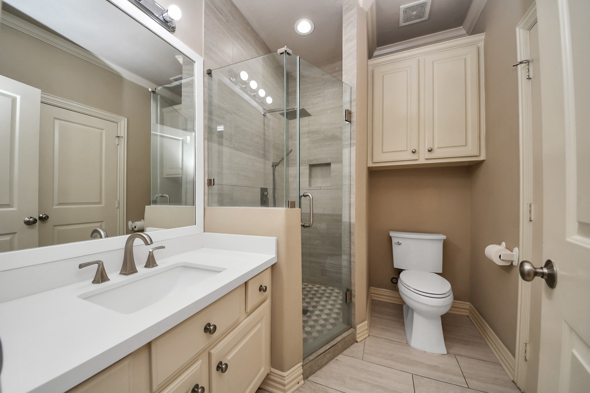 14454 Summerleaf Lane Houston, TX 77077 - Photo 38 of 50 a bathroom with a sink a toilet and shower