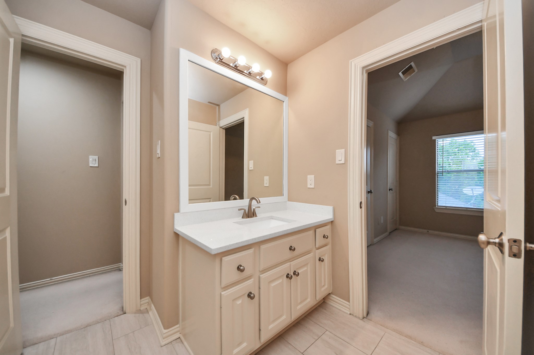 14454 Summerleaf Lane Houston, TX 77077 - Photo 48 of 50 a bathroom with a sink a mirror and a vanity
