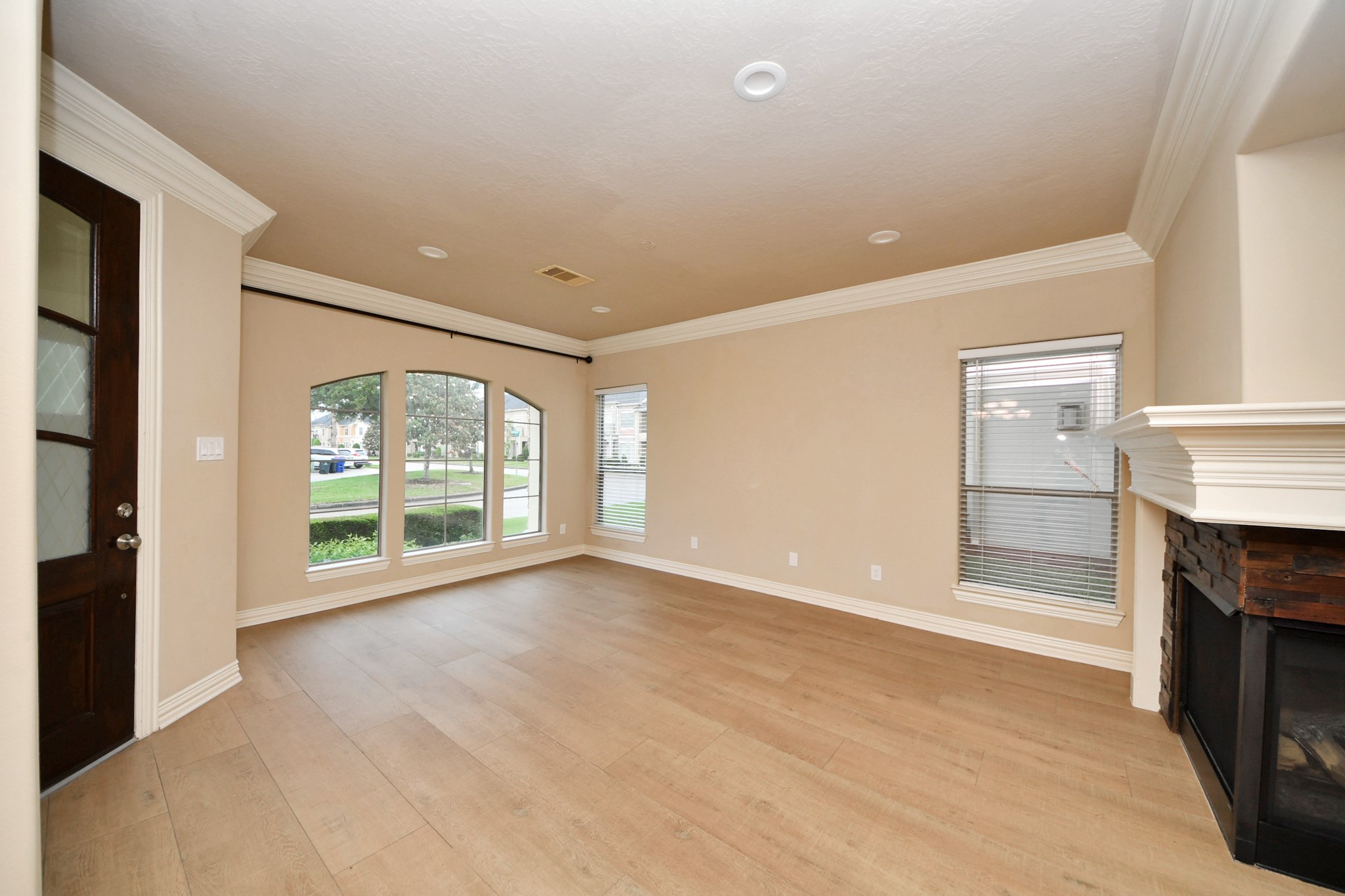 14454 Summerleaf Lane Houston, TX 77077 - Photo 5 of 50 a view of an empty room with a fireplace and a window