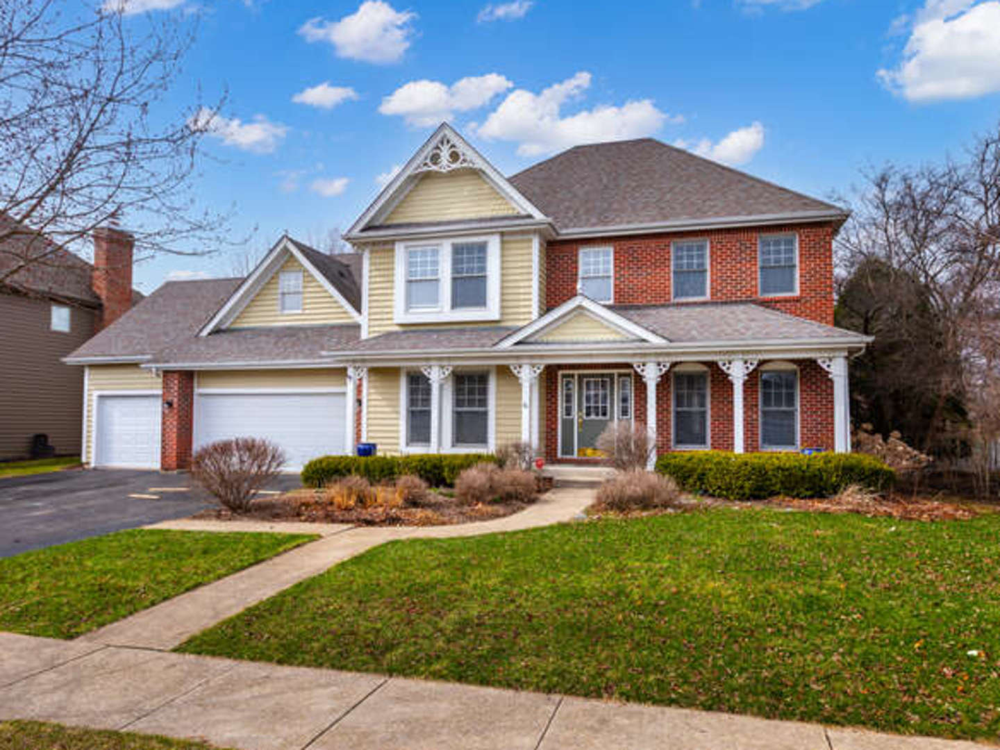 40-w046 Carl Sandburg Road St. Charles, IL 60175 - Photo 1 of 29 a front view of a house with garden