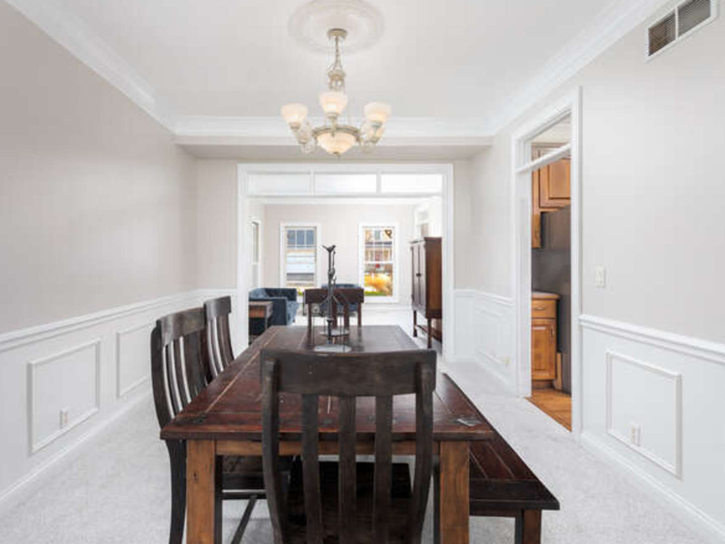 40-w046 Carl Sandburg Road St. Charles, IL 60175 - Photo 6 of 29 a view of a dining room with furniture a chandelier and wooden floor