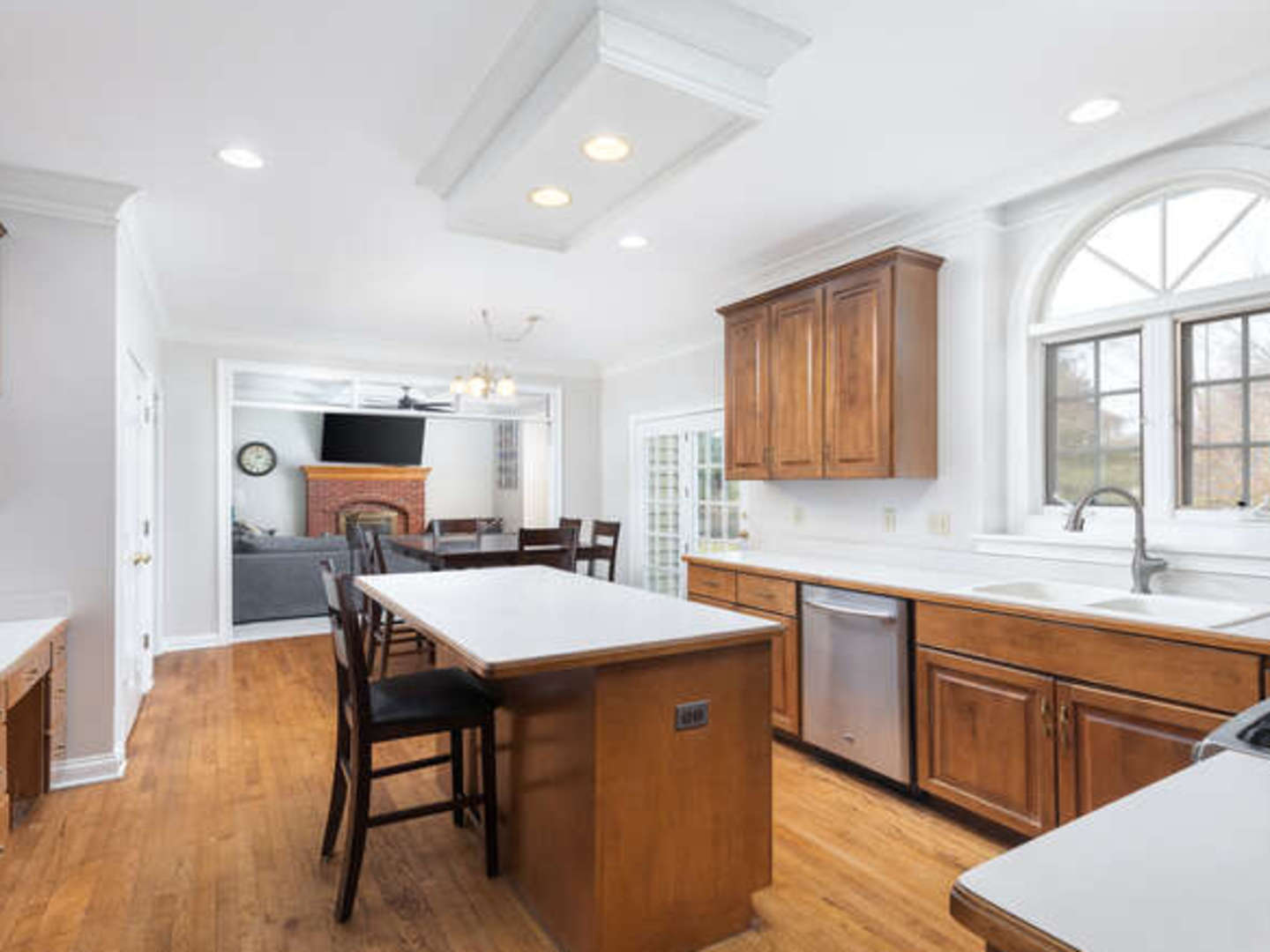 40-w046 Carl Sandburg Road St. Charles, IL 60175 - Photo 8 of 29 a kitchen with stainless steel appliances granite countertop table chairs sink refrigerator and cabinets