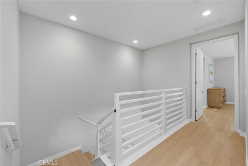 136 Modjeska Irvine, CA 92618 - Photo 18 of 39 a view of room with stairs and a wooden floor