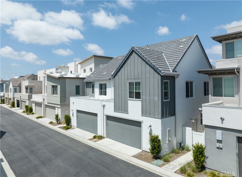 136 Modjeska Irvine, CA 92618 - Photo 2 of 39 a front view of a house with a yard and garage