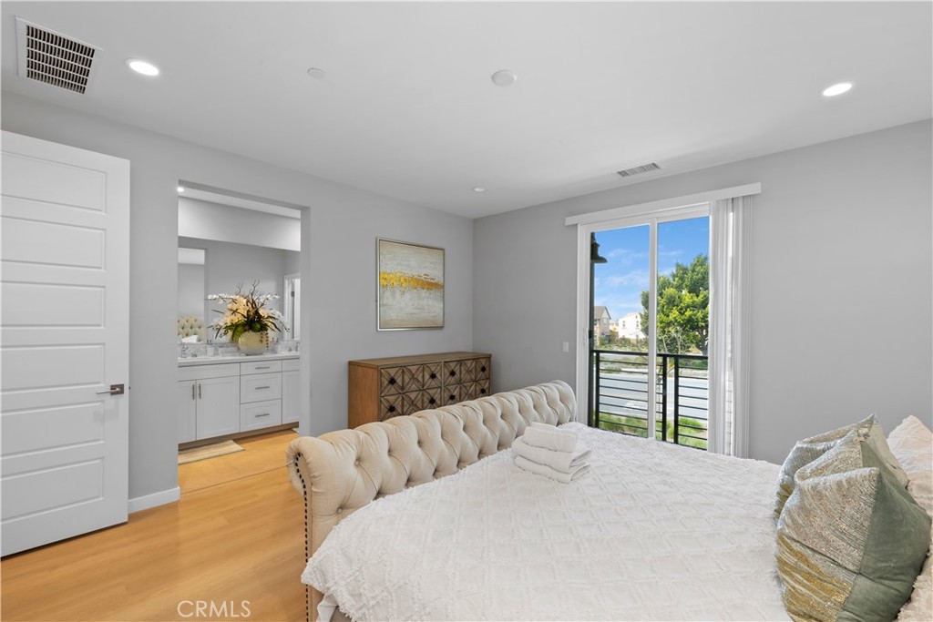 136 Modjeska Irvine, CA 92618 - Photo 23 of 39 a bedroom with a large bed and a window