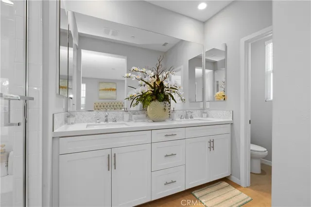 a bathroom with a sink a vanity and a mirror
