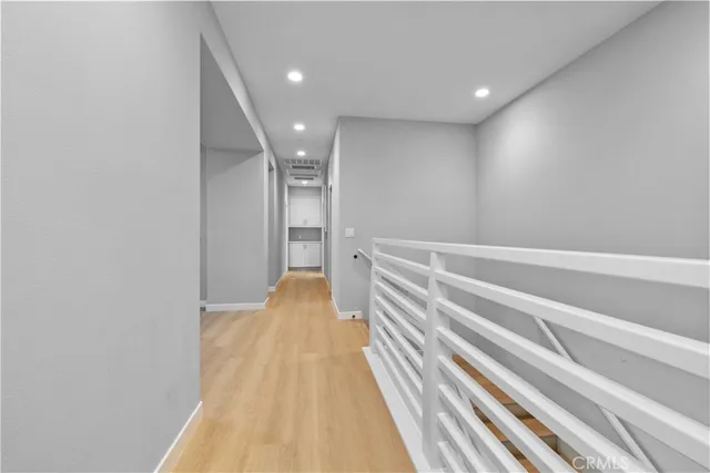 a bedroom with two beds and a window