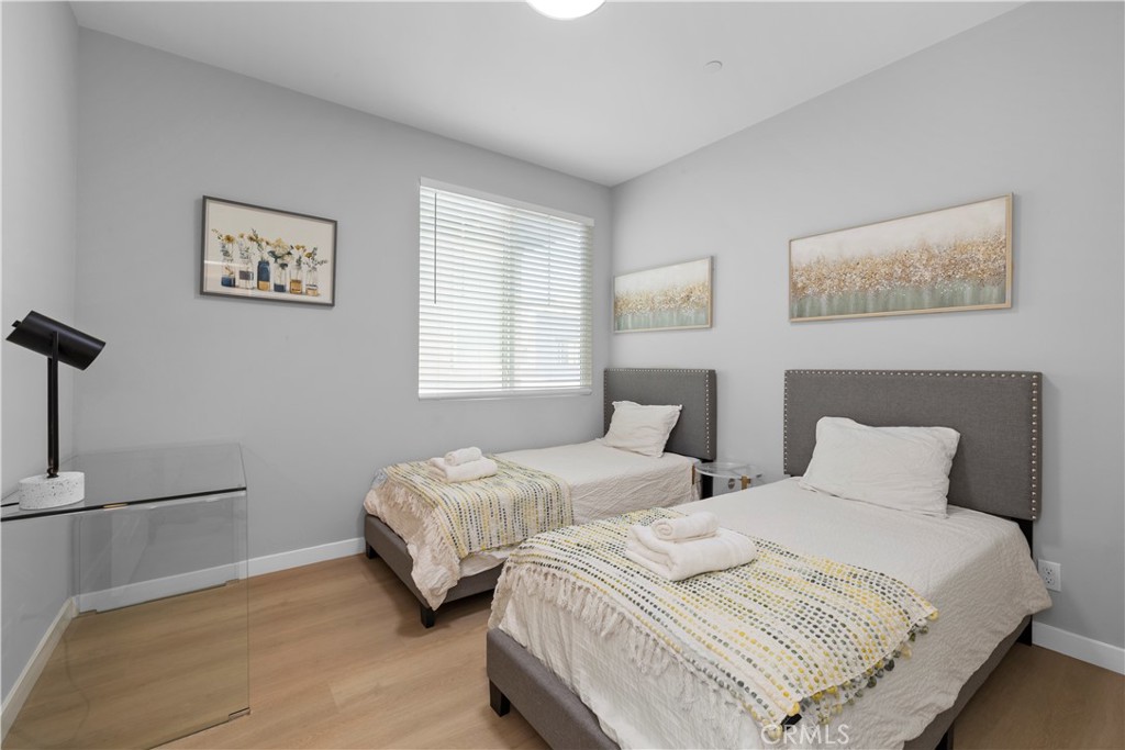 136 Modjeska Irvine, CA 92618 - Photo 27 of 39 a bedroom with two beds and a window
