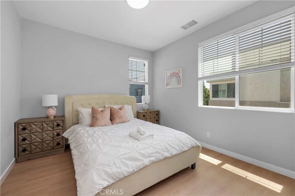 136 Modjeska Irvine, CA 92618 - Photo 29 of 39 a bedroom with a bed and window