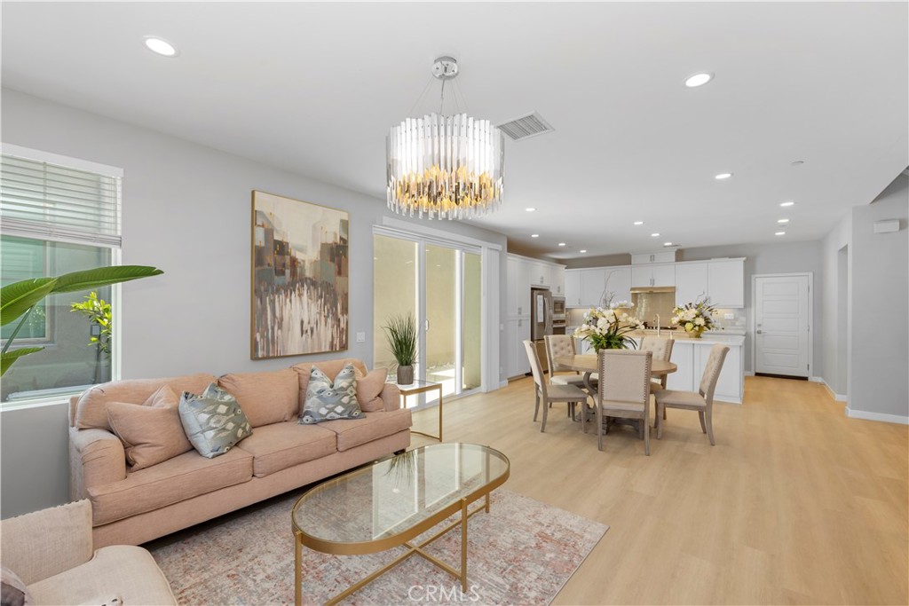 136 Modjeska Irvine, CA 92618 - Photo 3 of 39 a living room with furniture chandelier and a window