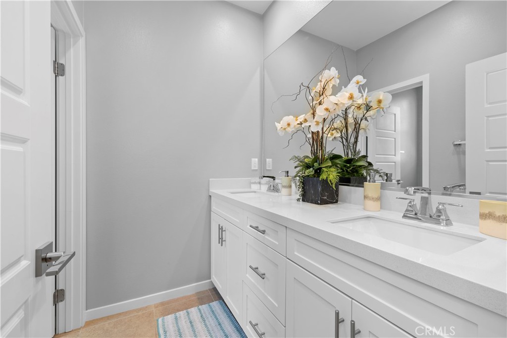 136 Modjeska Irvine, CA 92618 - Photo 32 of 39 a bathroom with a sink a vanity and a mirror