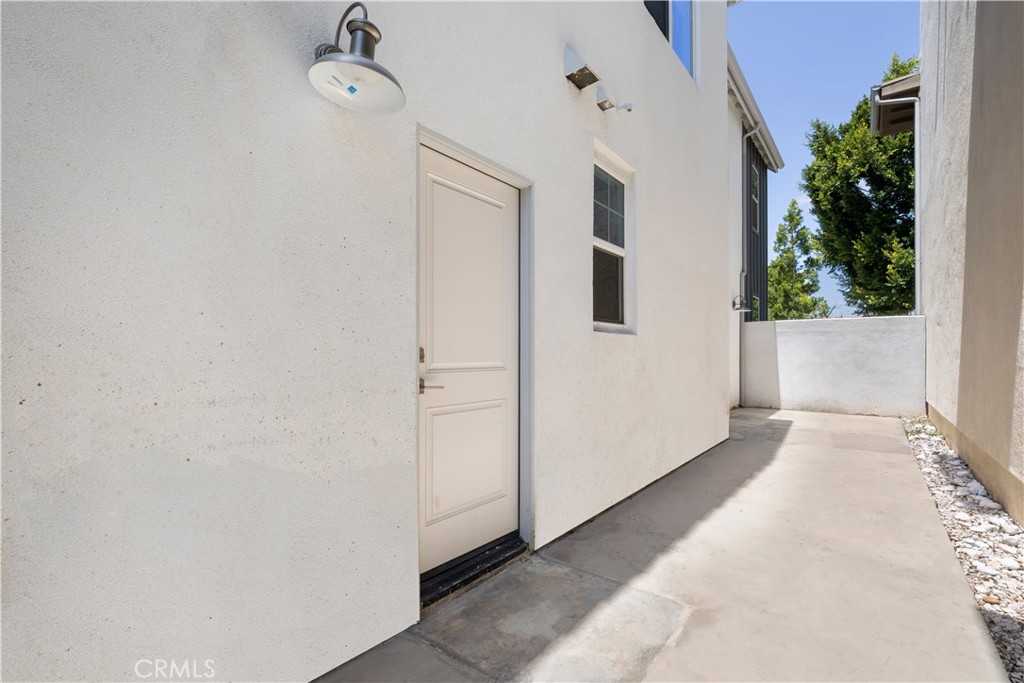 136 Modjeska Irvine, CA 92618 - Photo 36 of 39 a view of a livingroom with wooden floor and entryway