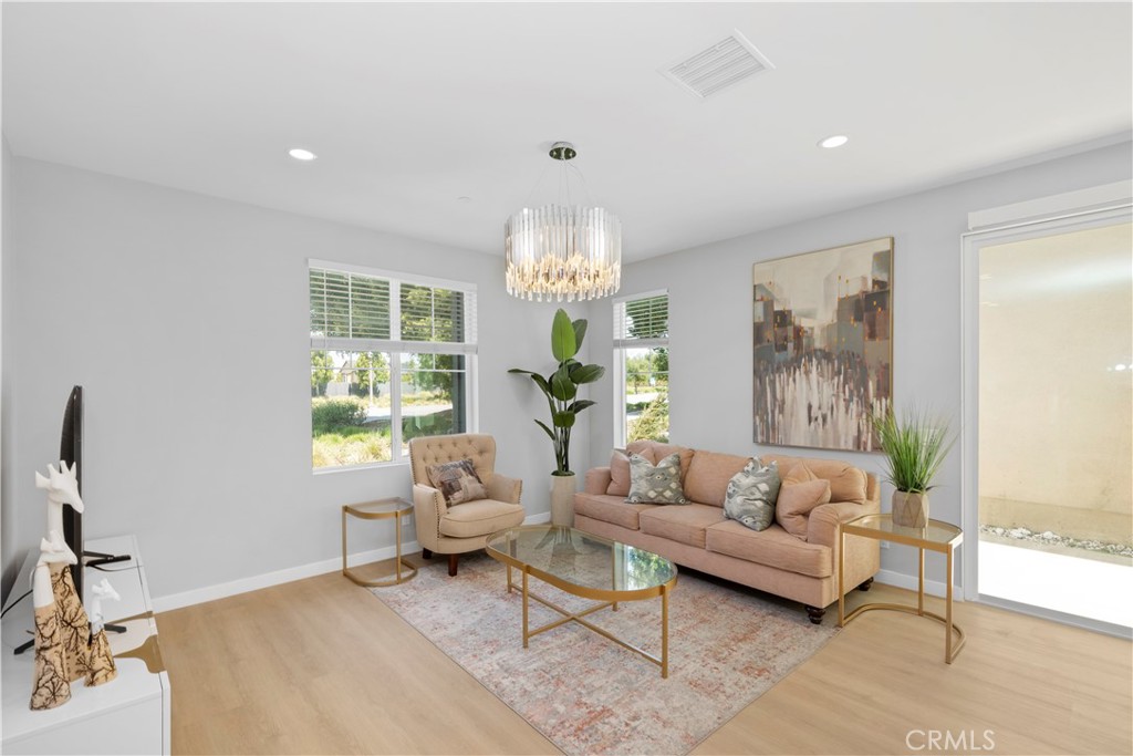 136 Modjeska Irvine, CA 92618 - Photo 4 of 39 a living room with furniture a chandelier and a chandelier