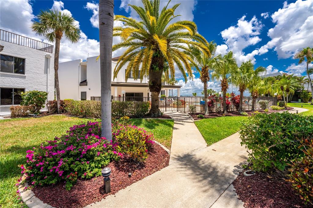 2955 North Beach Road, Unit B614 Englewood, FL 34223 - Photo 39 of 67 a view of a garden with flower plants
