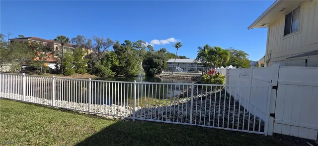 a view of a yard and front of a house