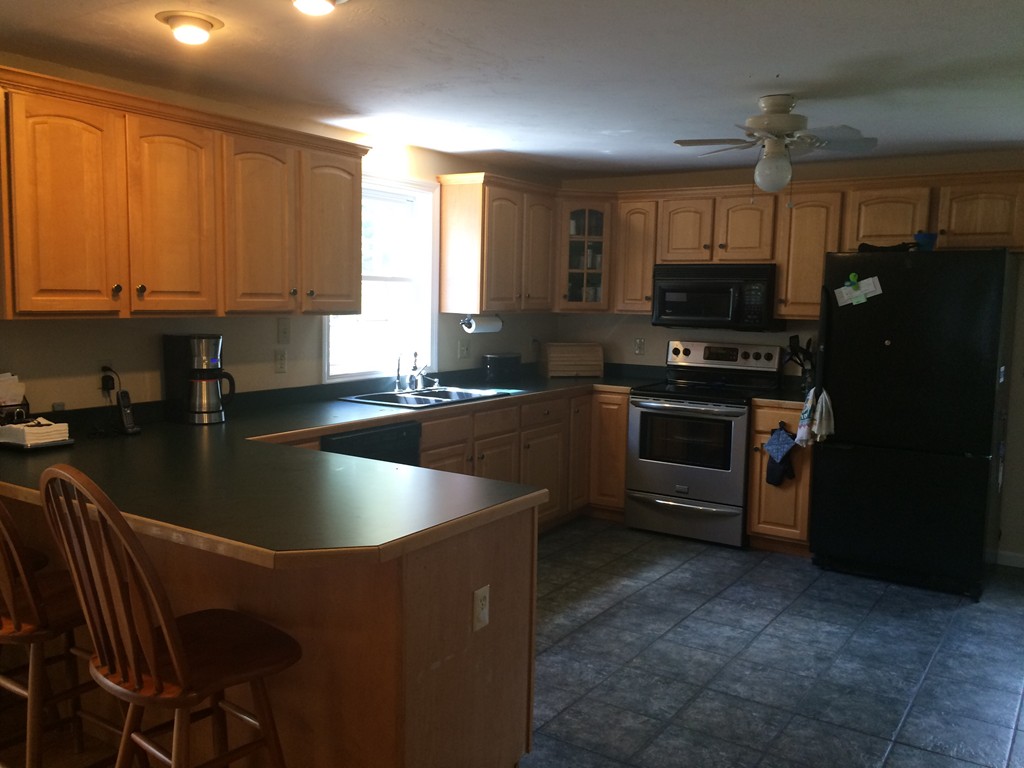 175 Hubbardston Road Princeton, MA 01541 - Photo 8 of 24 a kitchen with stainless steel appliances granite countertop a sink stove and refrigerator