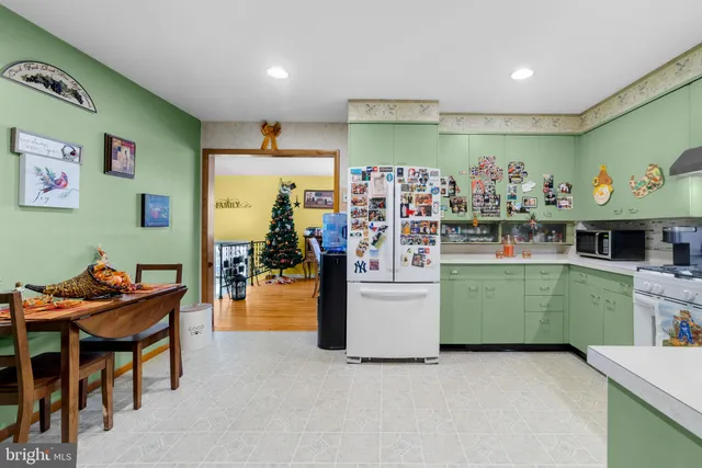 a bathroom with a sink vanity mirror and toilet