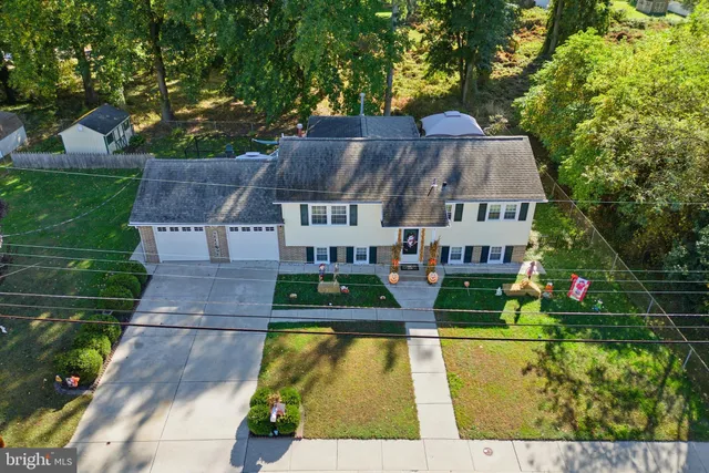 a aerial view of a house with swimming pool garden and patio
