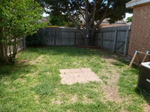 a backyard of a house with lots of green space