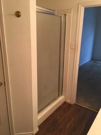 a bathroom with a glass door