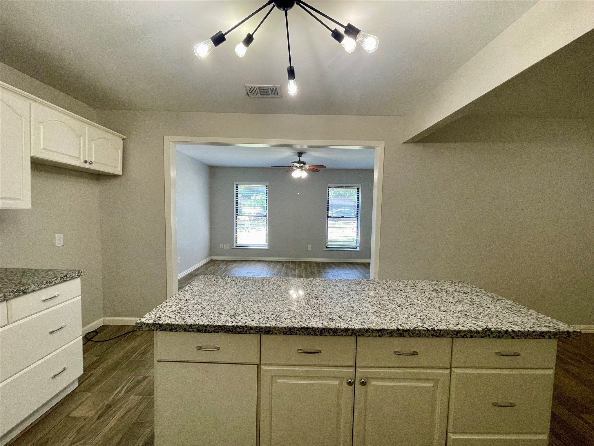 300 Hargett Street Clute, TX 77531 - Photo 12 of 36 a bathroom with a granite countertop sink and a mirror