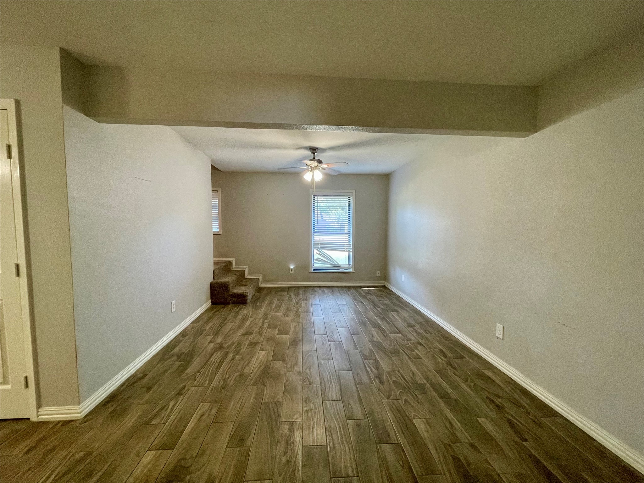 300 Hargett Street Clute, TX 77531 - Photo 14 of 36 a view of a room with wooden floor and window