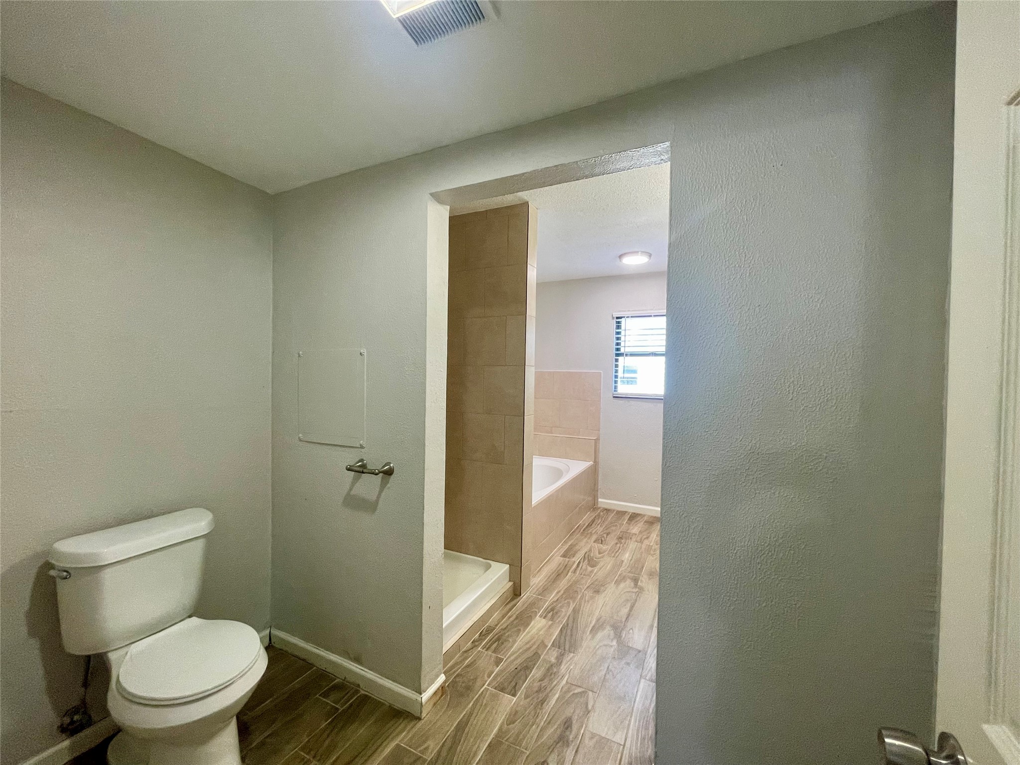 300 Hargett Street Clute, TX 77531 - Photo 16 of 36 a bathroom with a toilet and a shower