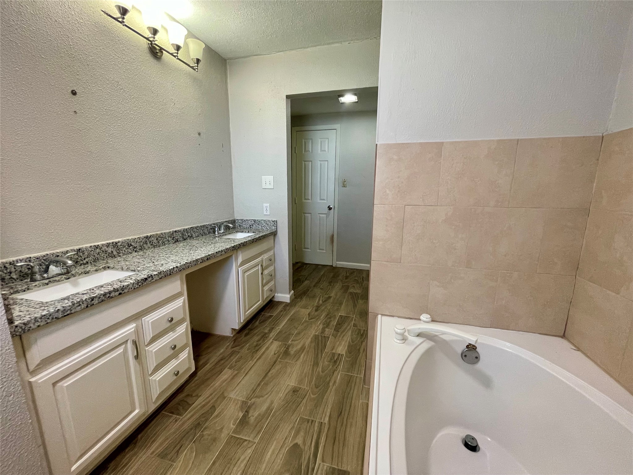300 Hargett Street Clute, TX 77531 - Photo 20 of 36 a bathroom with a granite countertop sink a washer and dryer