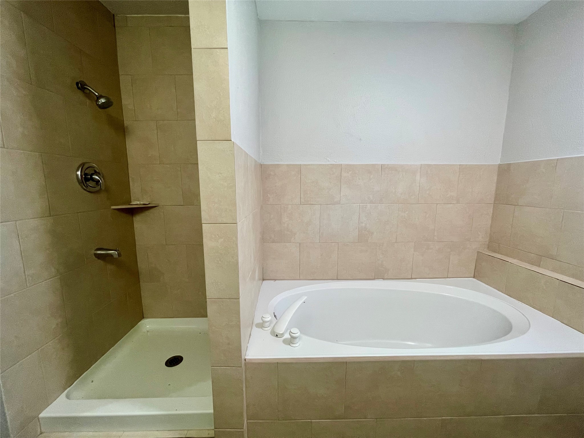 300 Hargett Street Clute, TX 77531 - Photo 21 of 36 a bathroom with a tub and shower