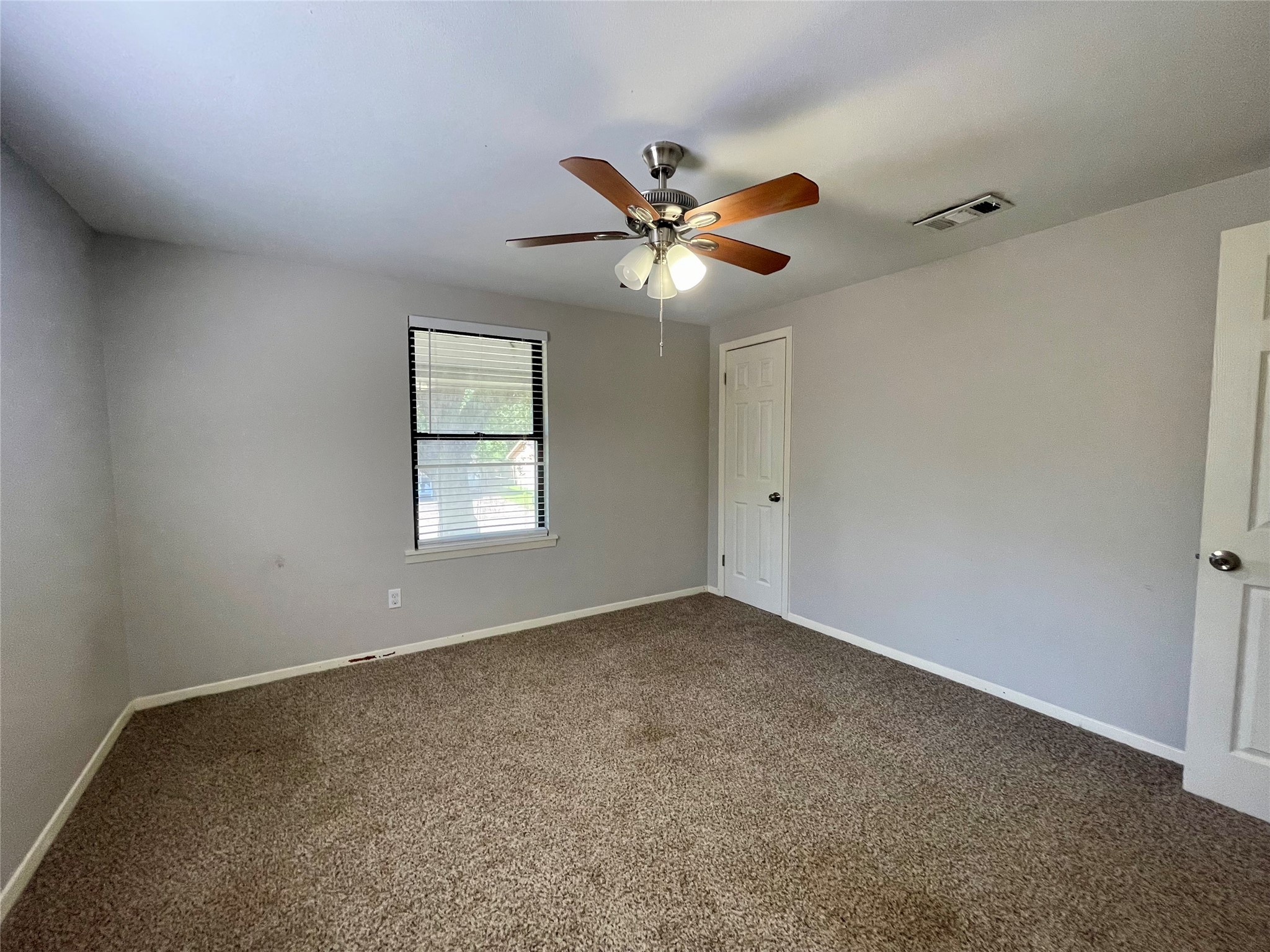 300 Hargett Street Clute, TX 77531 - Photo 23 of 36 a view of an empty room with a window