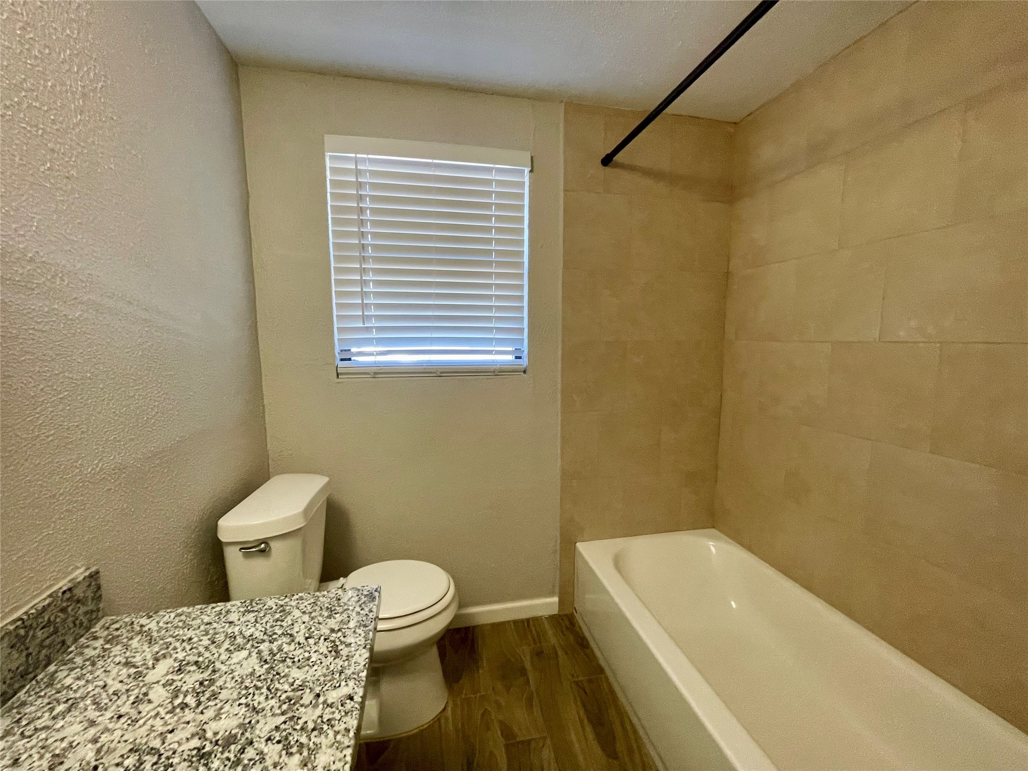 300 Hargett Street Clute, TX 77531 - Photo 31 of 36 a bathroom with a sink a toilet and a bathtub