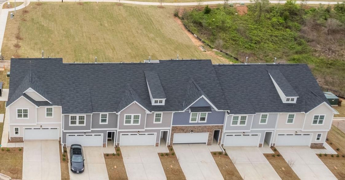7610 Waypond Court Raleigh, NC 27617 - Photo 3 of 13 an aerial view of residential houses with yard