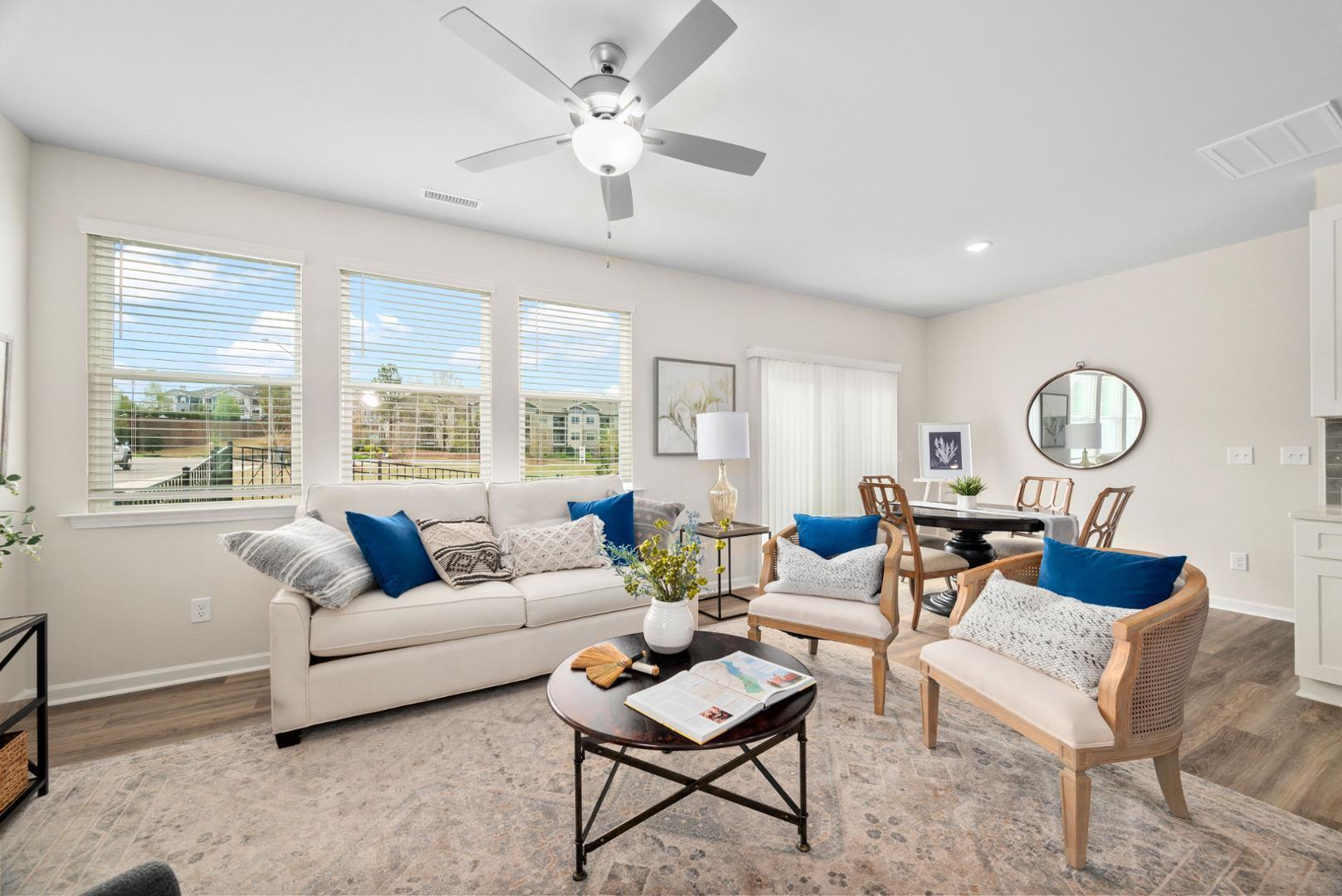 7610 Waypond Court Raleigh, NC 27617 - Photo 6 of 13 a living room with furniture and a large window