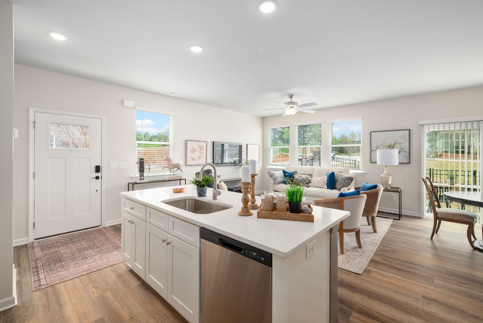 7610 Waypond Court Raleigh, NC 27617 - Photo 9 of 13 a view of a kitchen area with furniture and wooden floor