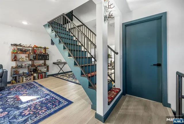 a living room with furniture and a rug