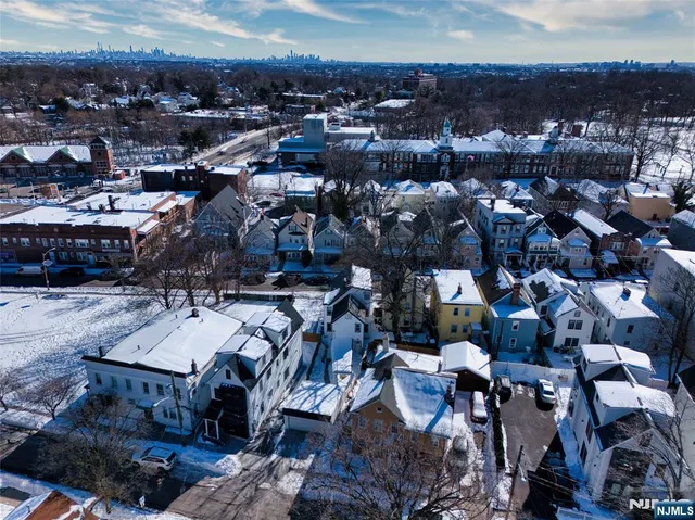 an aerial view of a residential apartment building with a city view