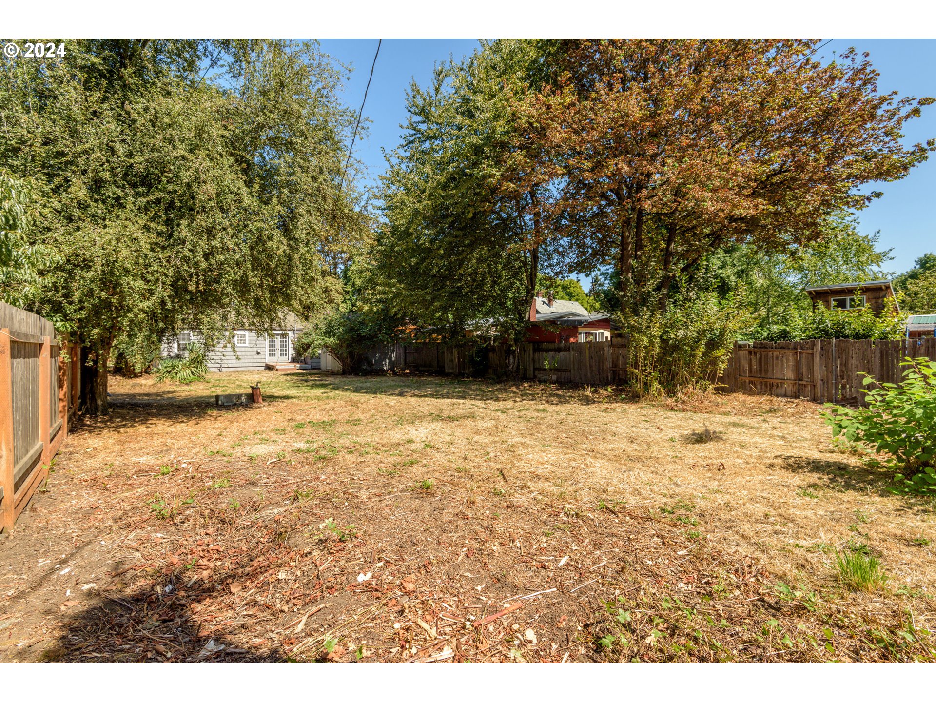 1476 West 4th Avenue Eugene, OR 97402 - Photo 23 of 26 a view of outdoor space with deck and trees